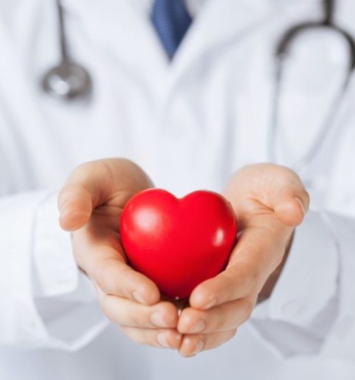 close up of man hands with heart cardiologist in Amritsar